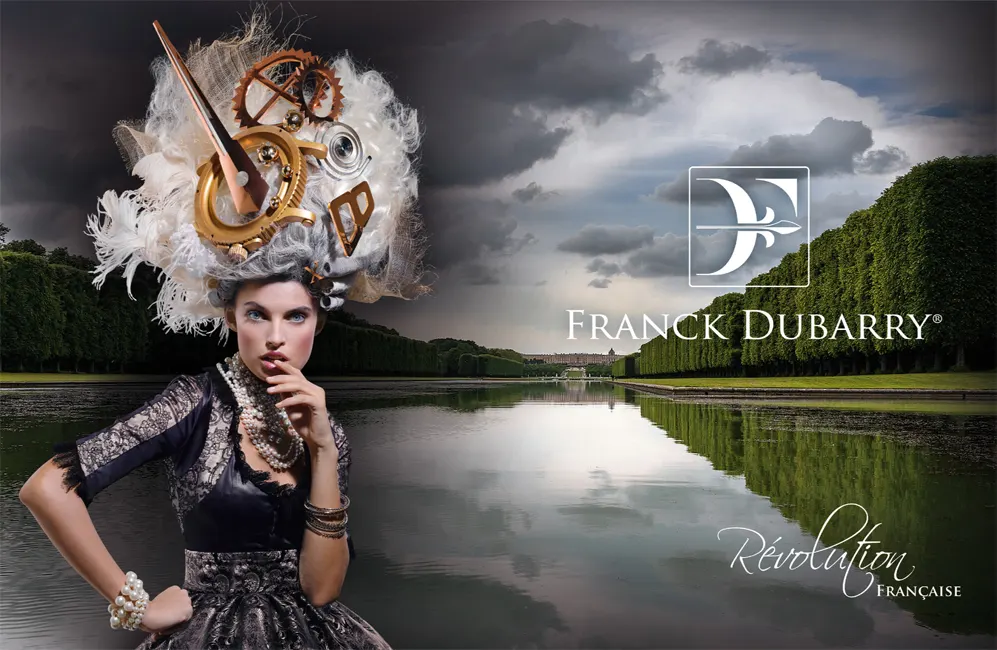 Model in elaborate 18th century dress with golden clockwork mechanism headpiece posed by reflecting pool under dramatic cloudy sky for Franck Dubarry